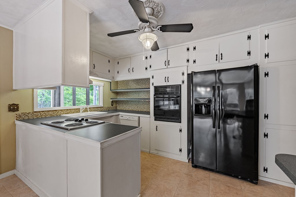 16 Hollow Springs Road Blue Ridge, GA 30513 - Photo 37 of 62 a kitchen with stainless steel appliances granite countertop a sink a refrigerator and a stove