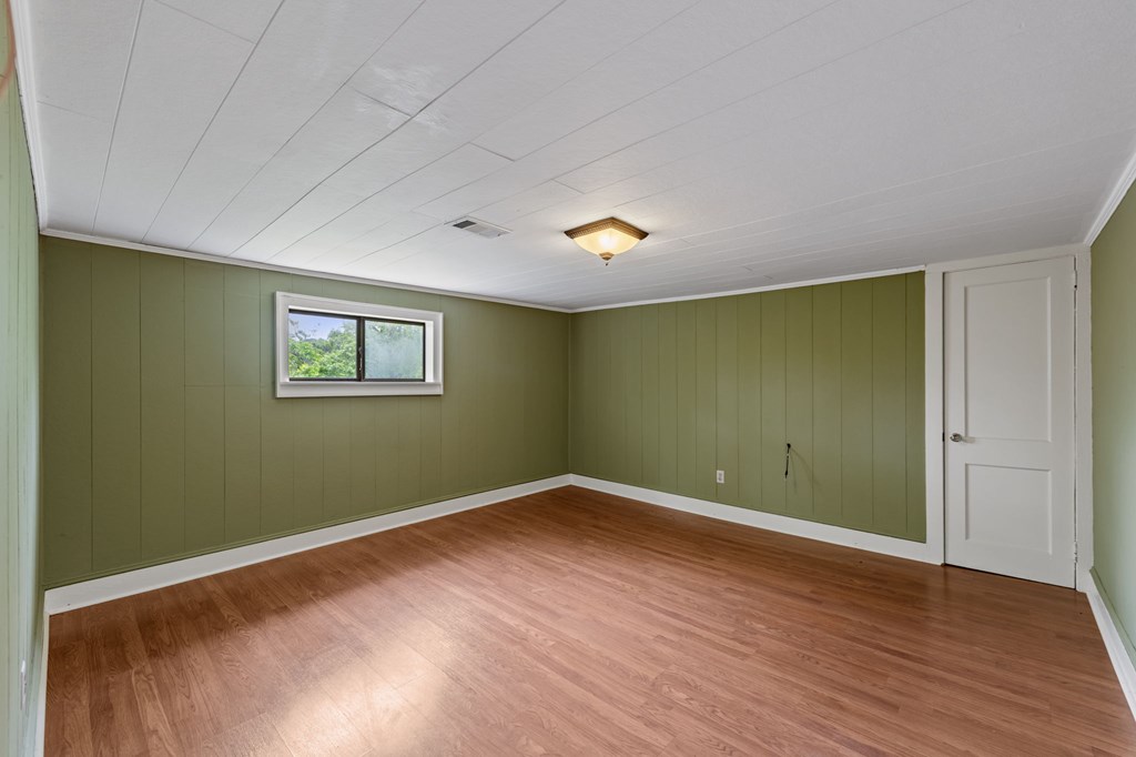 16 Hollow Springs Road Blue Ridge, GA 30513 - Photo 46 of 62 an empty room with wooden floor and windows