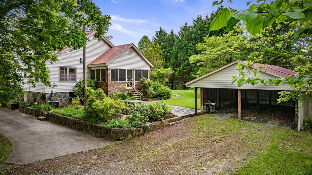 16 Hollow Springs Road Blue Ridge, GA 30513 - Photo 5 of 62 a house view with a garden space