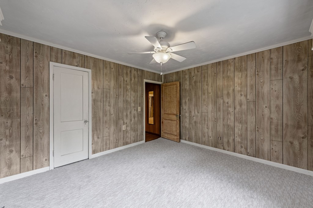 16 Hollow Springs Road Blue Ridge, GA 30513 - Photo 52 of 62 a view of an empty room with a ceiling fan