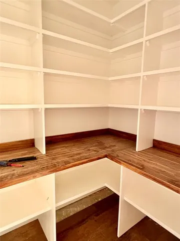 a view of a room with racks on the wall