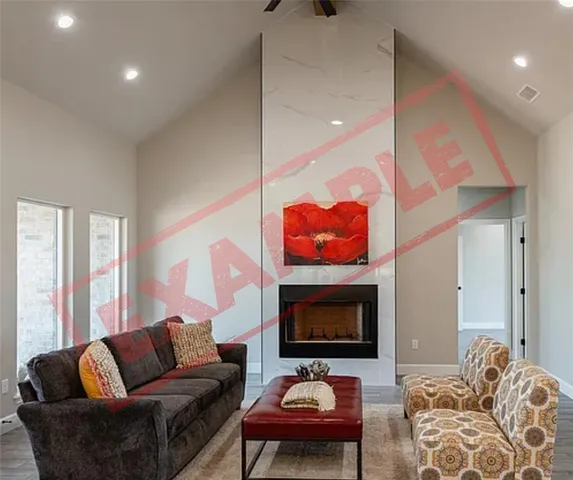 a living room with furniture kitchen view and a fireplace