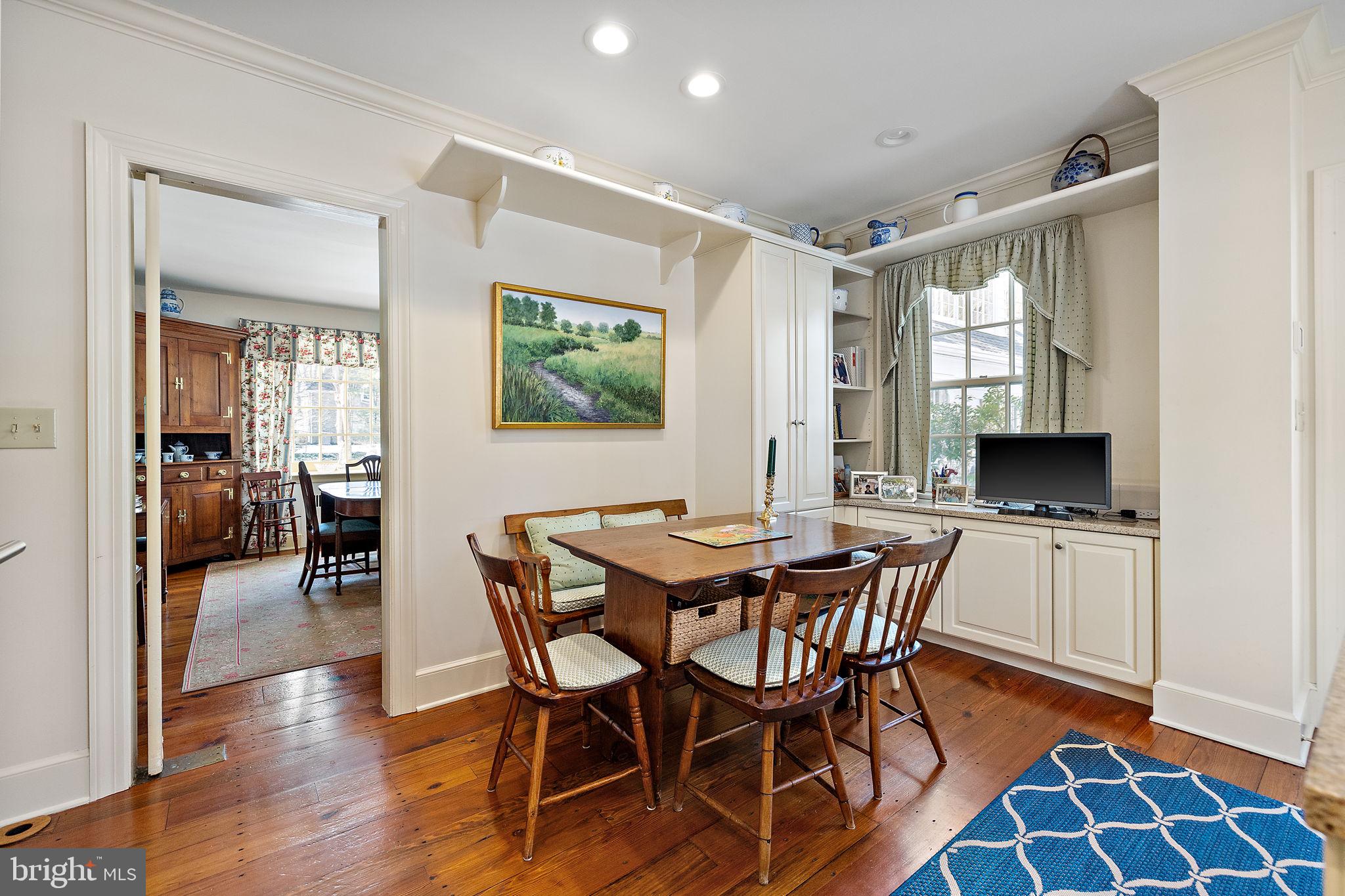 4615 Weldin Road Wilmington, DE 19803 - Photo 12 of 49 a view of a dining room with furniture and wooden floor