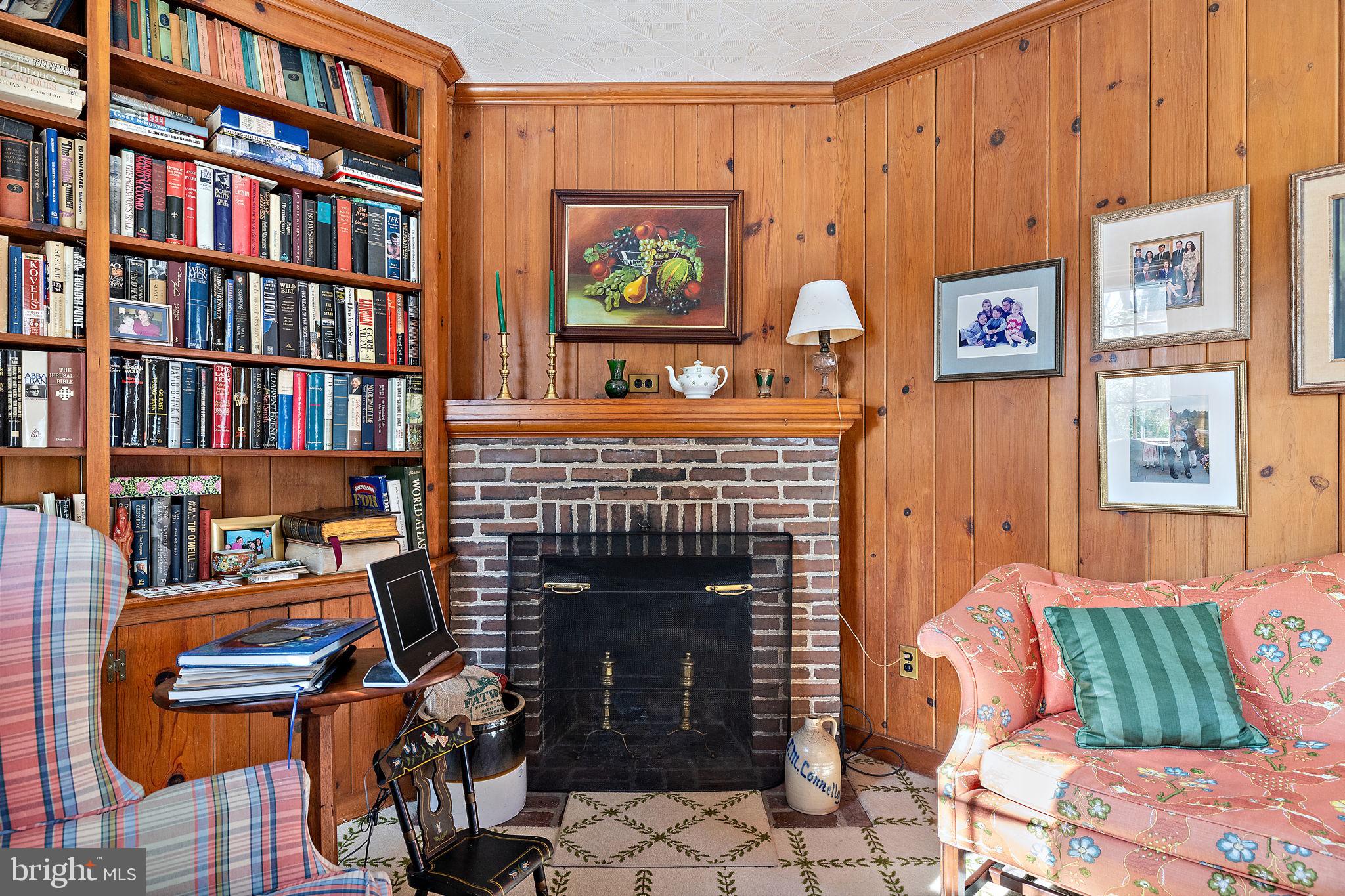 4615 Weldin Road Wilmington, DE 19803 - Photo 16 of 49 a living room with furniture a piano and a fireplace