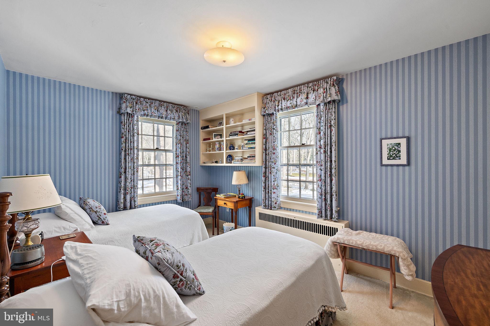 4615 Weldin Road Wilmington, DE 19803 - Photo 34 of 49 a bedroom with a bed and wooden floor