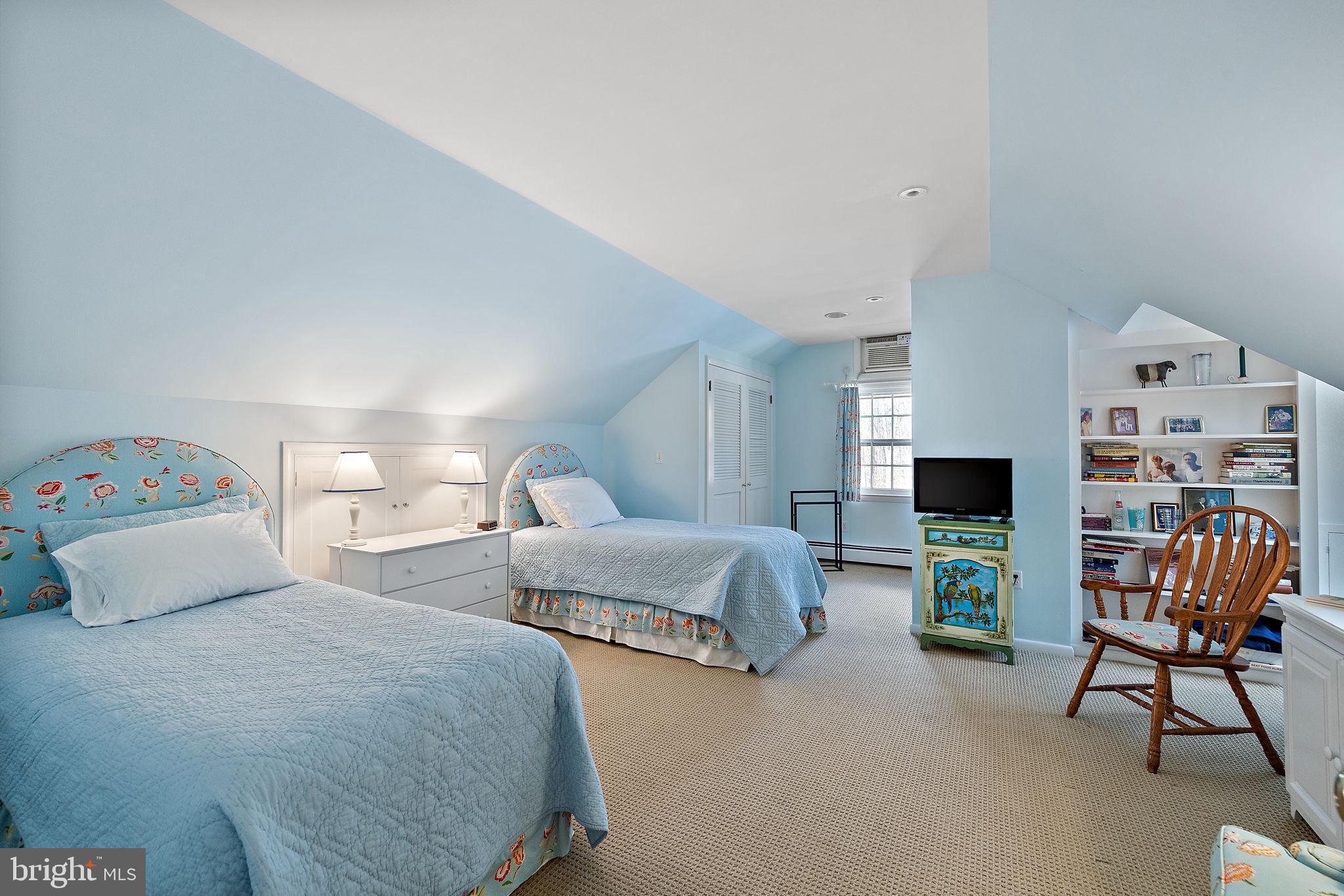 4615 Weldin Road Wilmington, DE 19803 - Photo 37 of 49 a bedroom with two beds and a chair