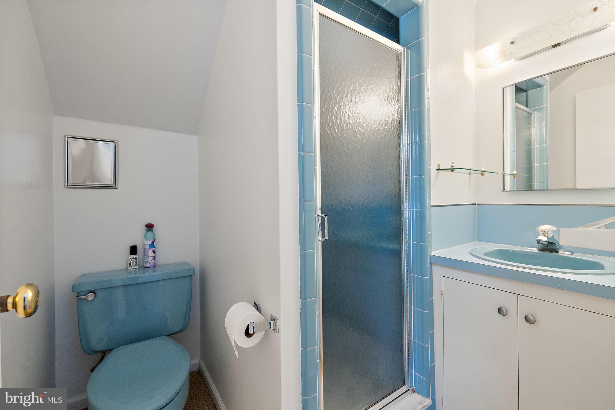 4615 Weldin Road Wilmington, DE 19803 - Photo 39 of 49 a bathroom with a toilet sink vanity and mirror