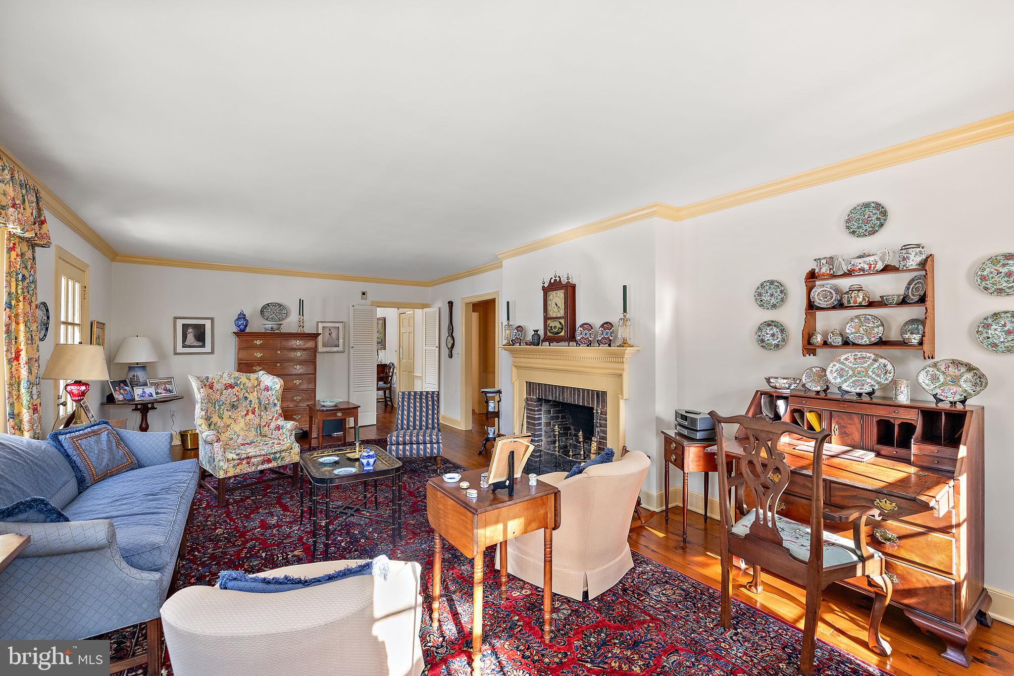 4615 Weldin Road Wilmington, DE 19803 - Photo 7 of 49 a living room with furniture and a fireplace