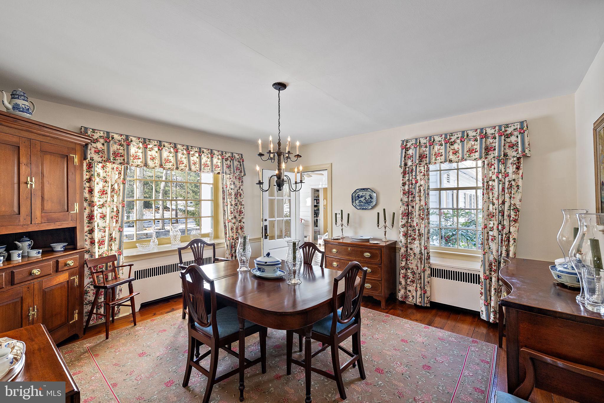 4615 Weldin Road Wilmington, DE 19803 - Photo 8 of 49 a view of a dining room with furniture window and wooden floor
