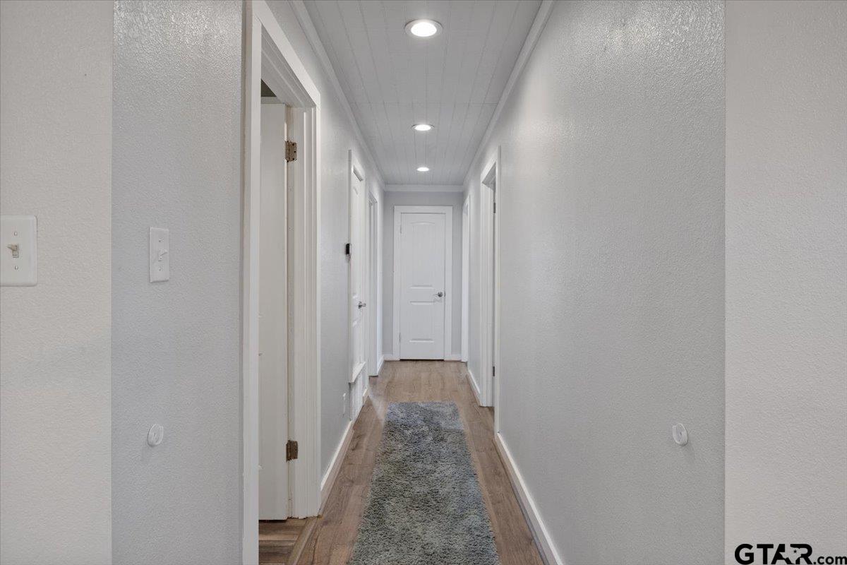 594 County Rd NE 2120 Talco, TX 75487 - Photo 16 of 36 a view of a hallway with white walls