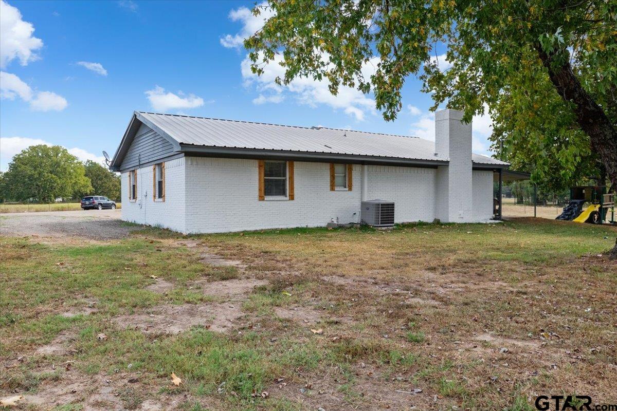 594 County Rd NE 2120 Talco, TX 75487 - Photo 22 of 36 a house view with a garden space