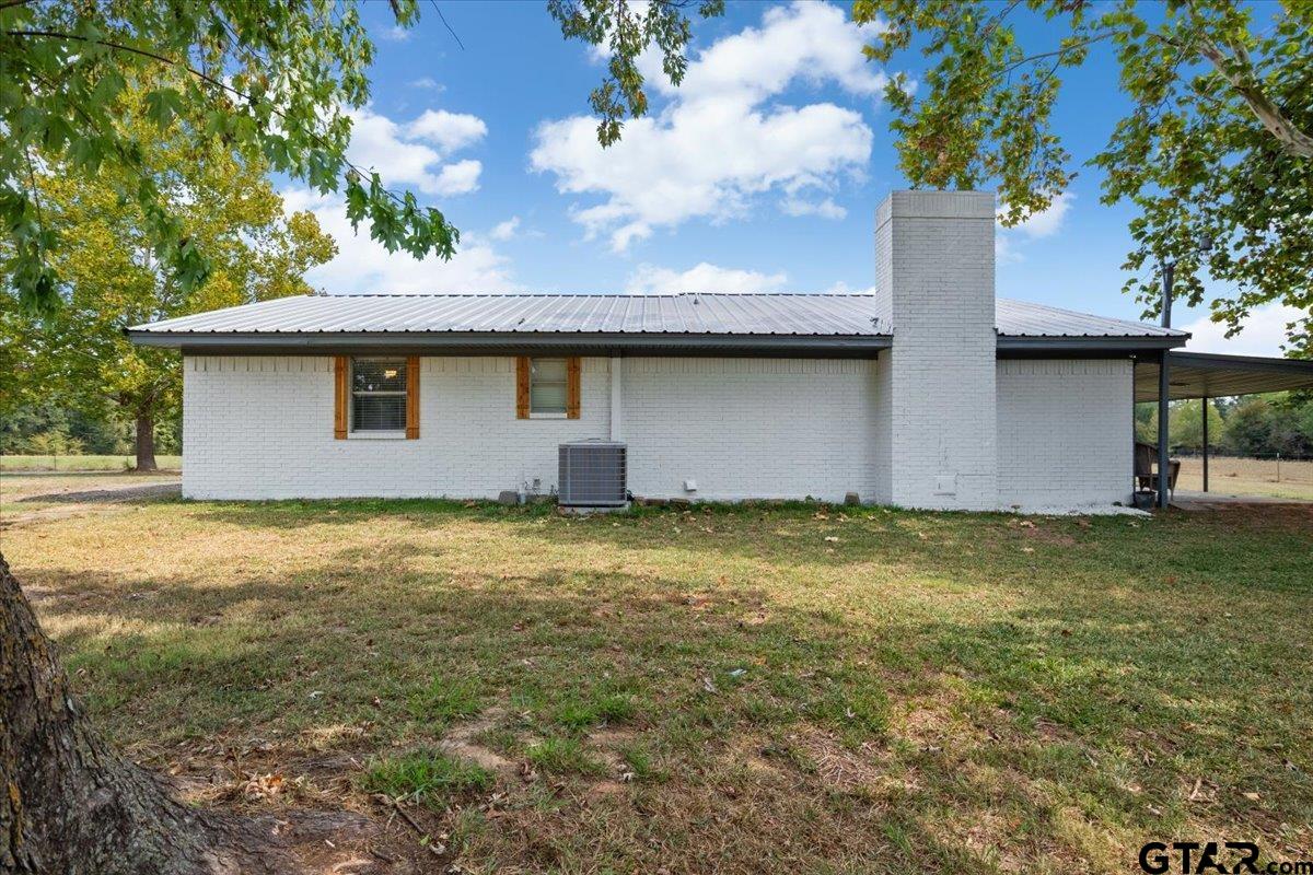 594 County Rd NE 2120 Talco, TX 75487 - Photo 23 of 36 a backyard of a house with lots of green space
