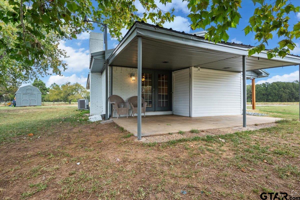 594 County Rd NE 2120 Talco, TX 75487 - Photo 25 of 36 a view of a house with a yard