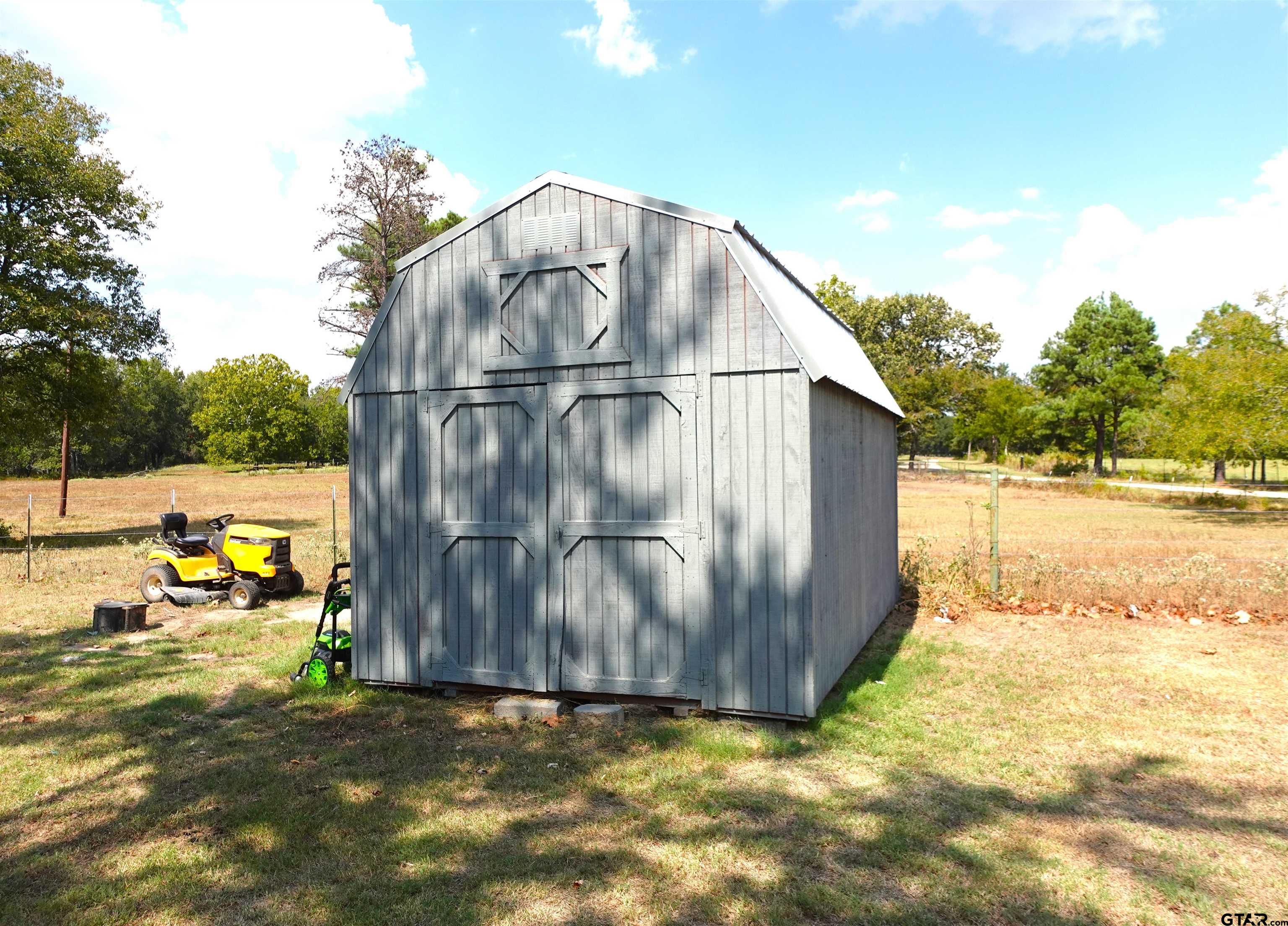 594 County Rd NE 2120 Talco, TX 75487 - Photo 27 of 36 a view of outdoor space with seating area and swimming pool