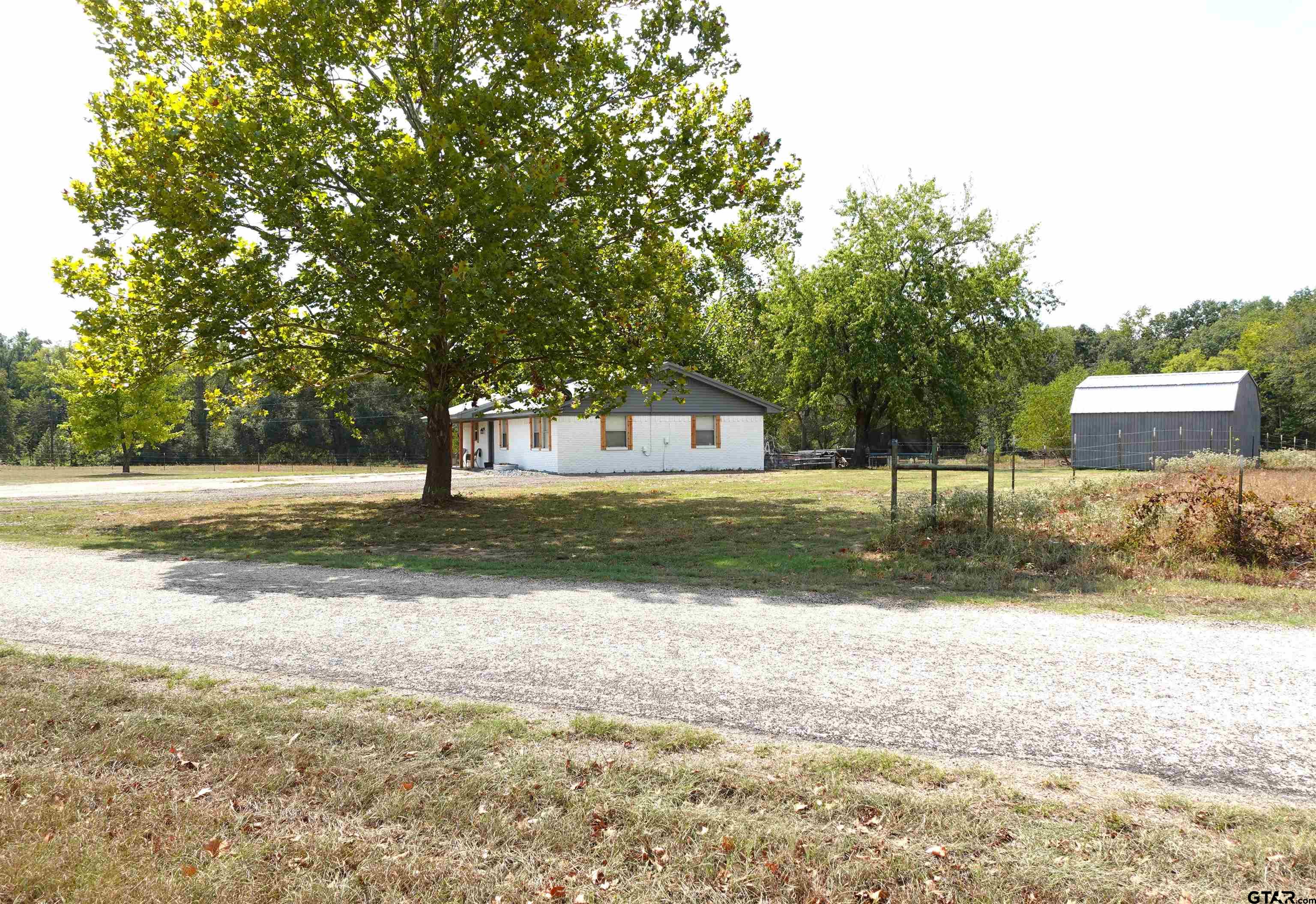 594 County Rd NE 2120 Talco, TX 75487 - Photo 36 of 36 a view of a yard with tree s
