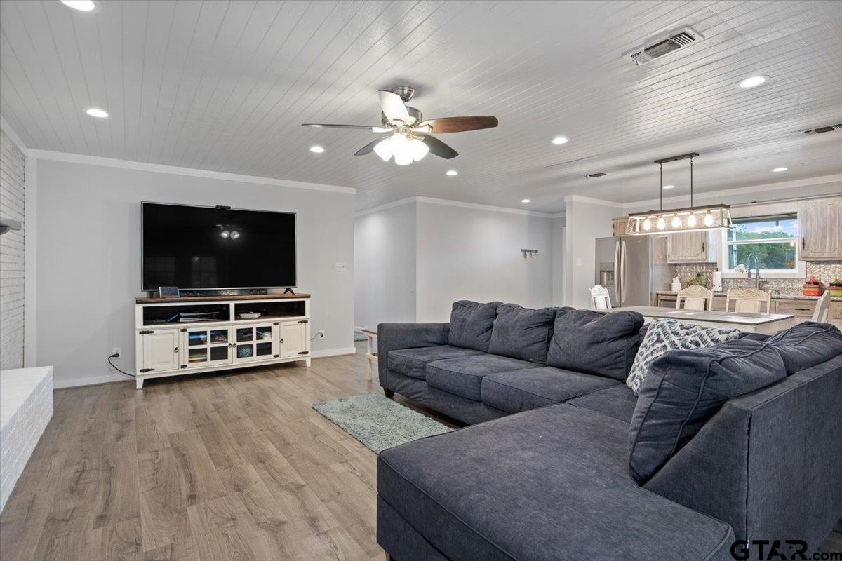 594 County Rd NE 2120 Talco, TX 75487 - Photo 6 of 36 a living room with furniture and a flat screen tv