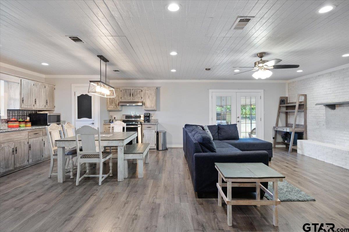 594 County Rd NE 2120 Talco, TX 75487 - Photo 7 of 36 a living room with lots of furniture and kitchen view
