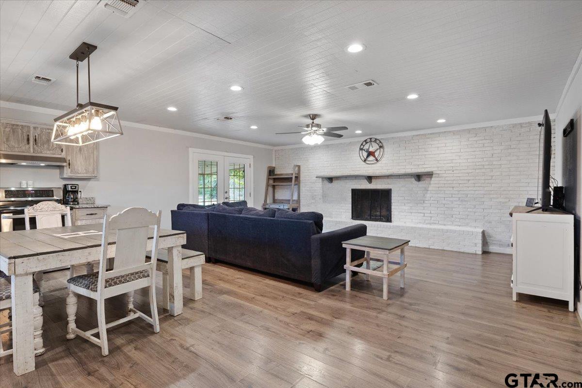 594 County Rd NE 2120 Talco, TX 75487 - Photo 8 of 36 a living room with furniture a fireplace and a flat screen tv