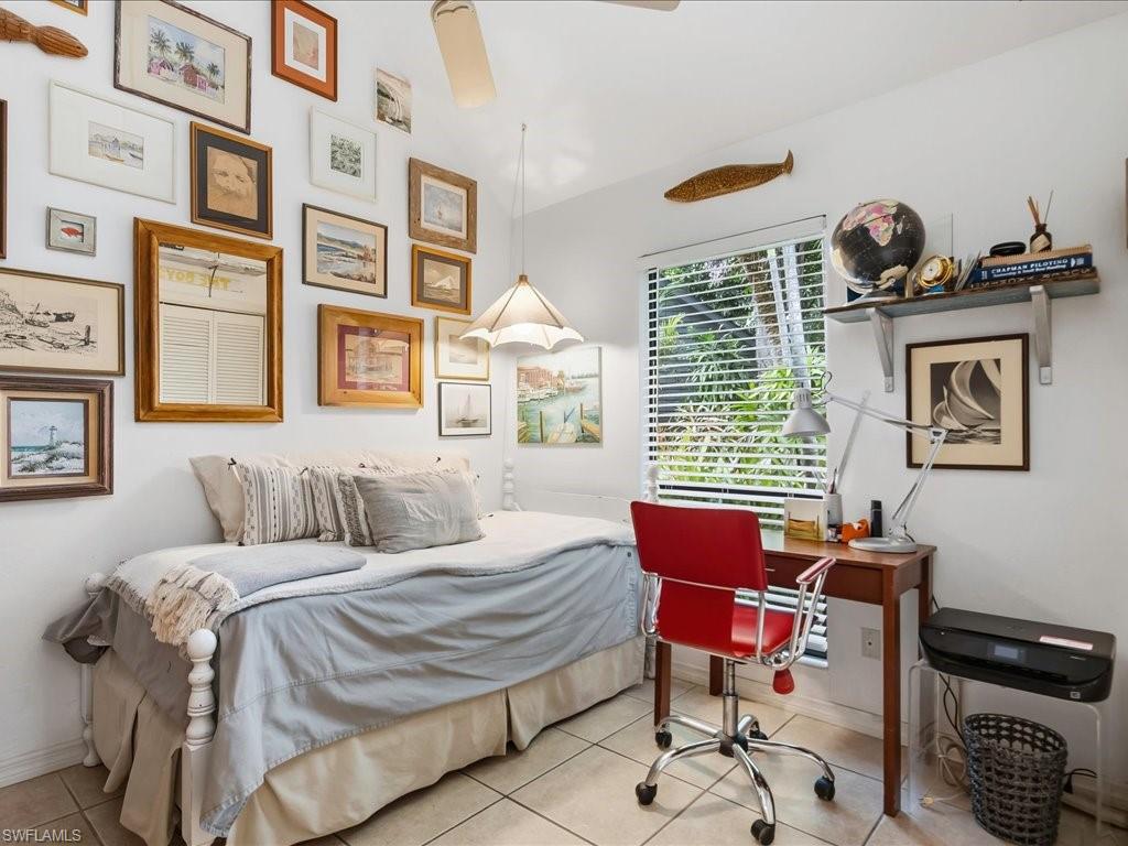 1337 Solana Road Naples, FL 34103 - Photo 15 of 23 Bright interior space featuring a window with white blinds, ceramic tile flooring, a built-in ceiling fan