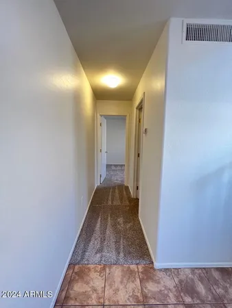 a bathroom with a toilet a sink and bathtub