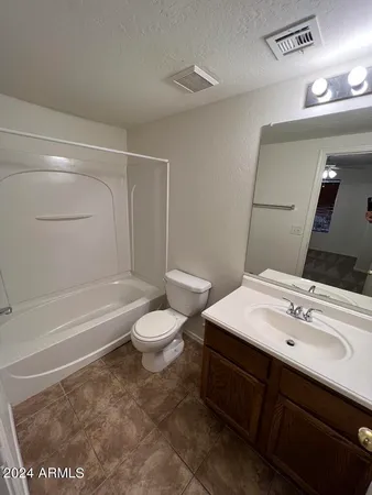a bathroom with a sink a toilet and bathtub