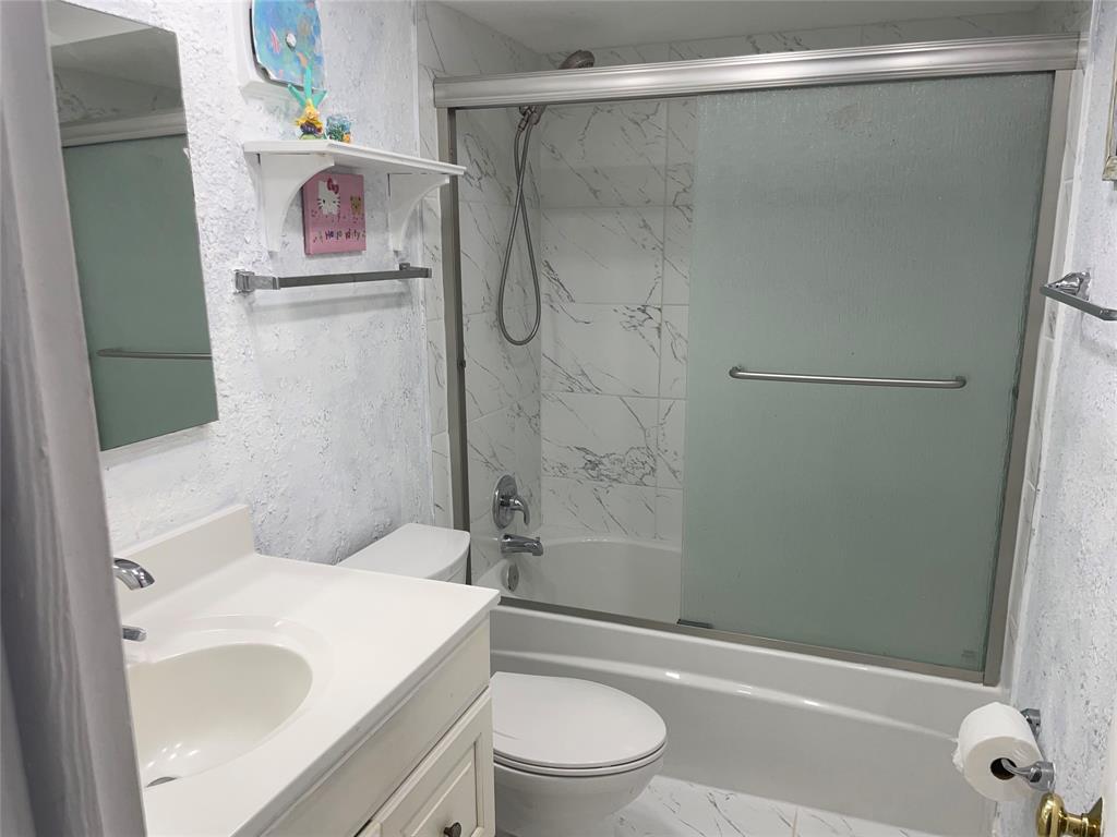 1775 Southwest 81st Way Davie, FL 33324 - Photo 16 of 35 a bathroom with a sink a toilet and shower