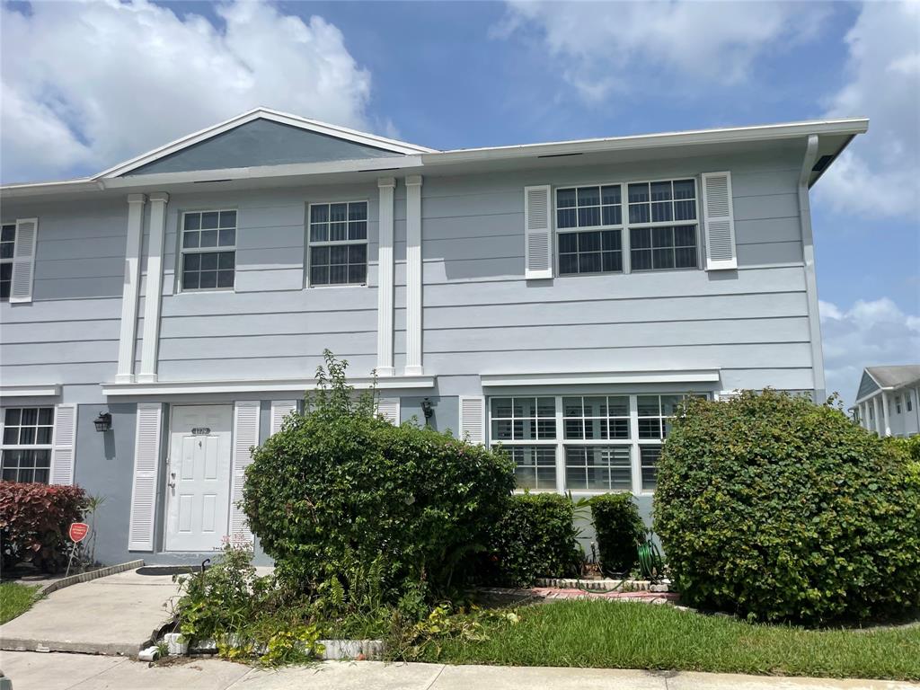 1775 Southwest 81st Way Davie, FL 33324 - Photo 2 of 35 a front view of a house with garden