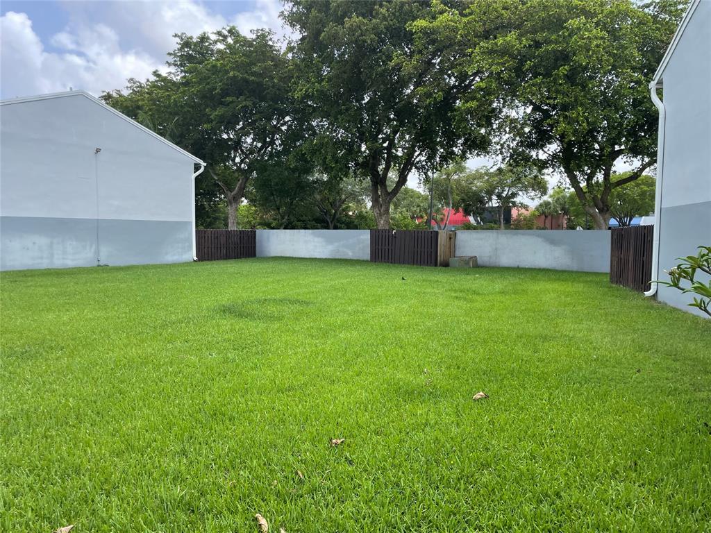 1775 Southwest 81st Way Davie, FL 33324 - Photo 23 of 35 a view of a house with a yard and a large tree