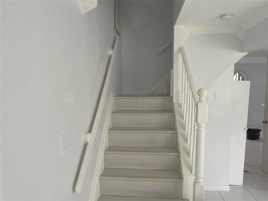 1775 Southwest 81st Way Davie, FL 33324 - Photo 4 of 35 a view of staircase with white walls and white door