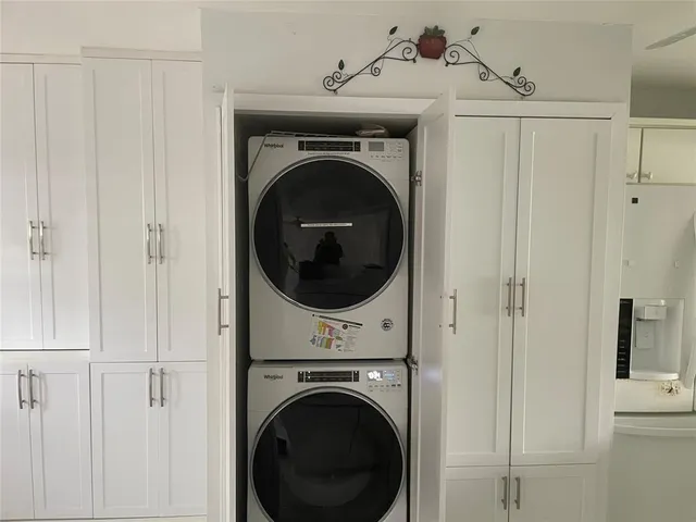a view of a hallway with washer and dryer