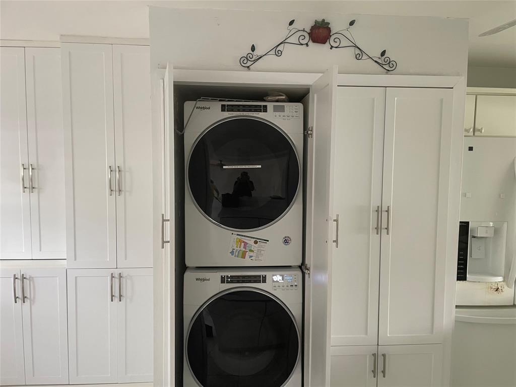 1775 Southwest 81st Way Davie, FL 33324 - Photo 7 of 35 a view of a hallway with washer and dryer