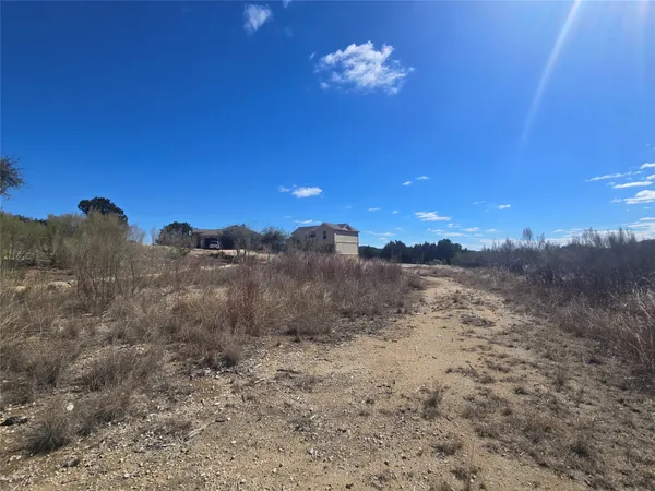 a view of a yard with a mountain