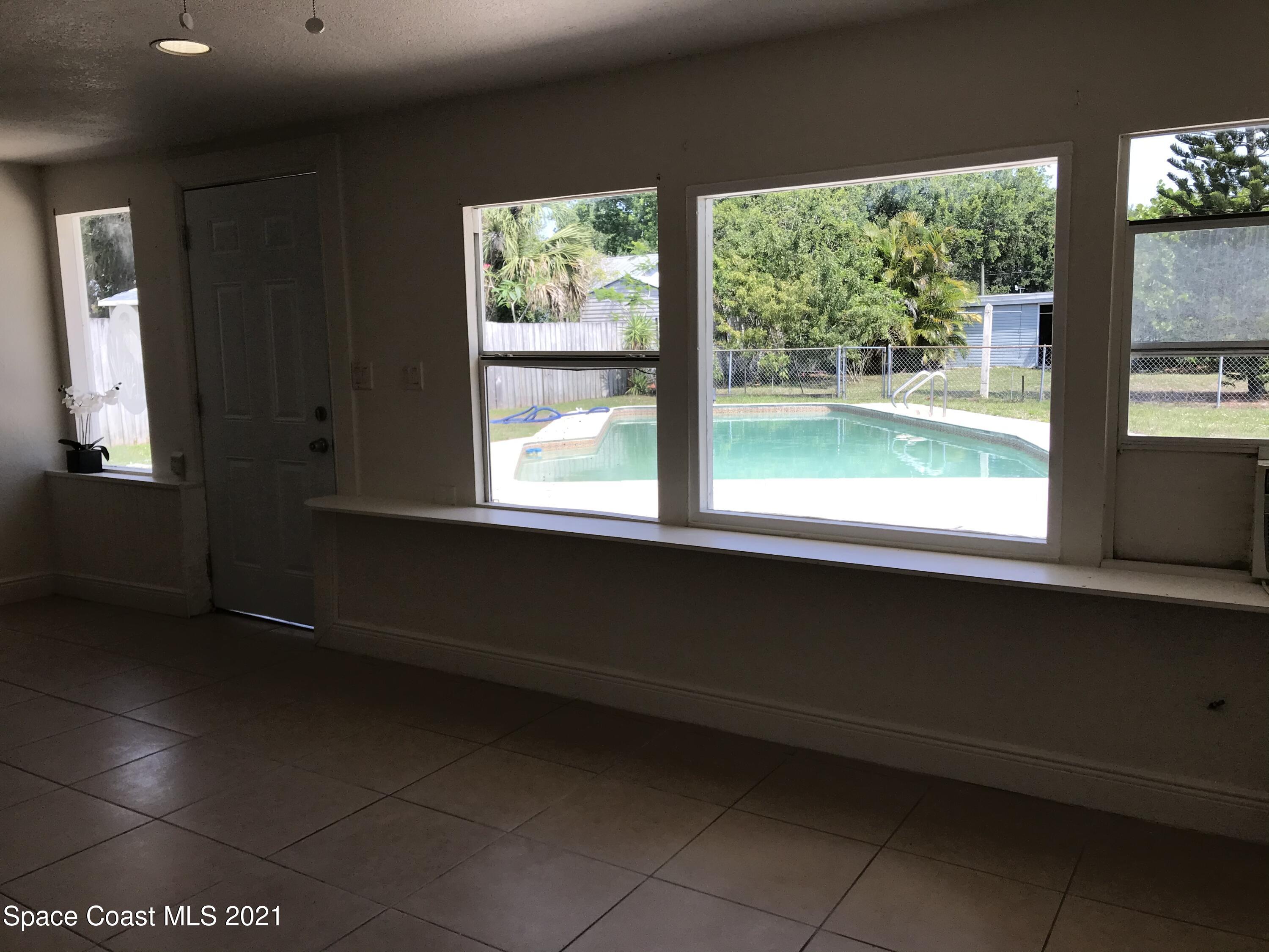2545 2nd Avenue Northeast Palm Bay, FL 32905 - Photo 11 of 32 a view of an empty room with a window