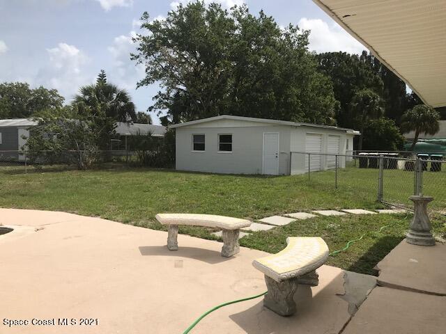 2545 2nd Avenue Northeast Palm Bay, FL 32905 - Photo 15 of 32 a view of a backyard with sitting area