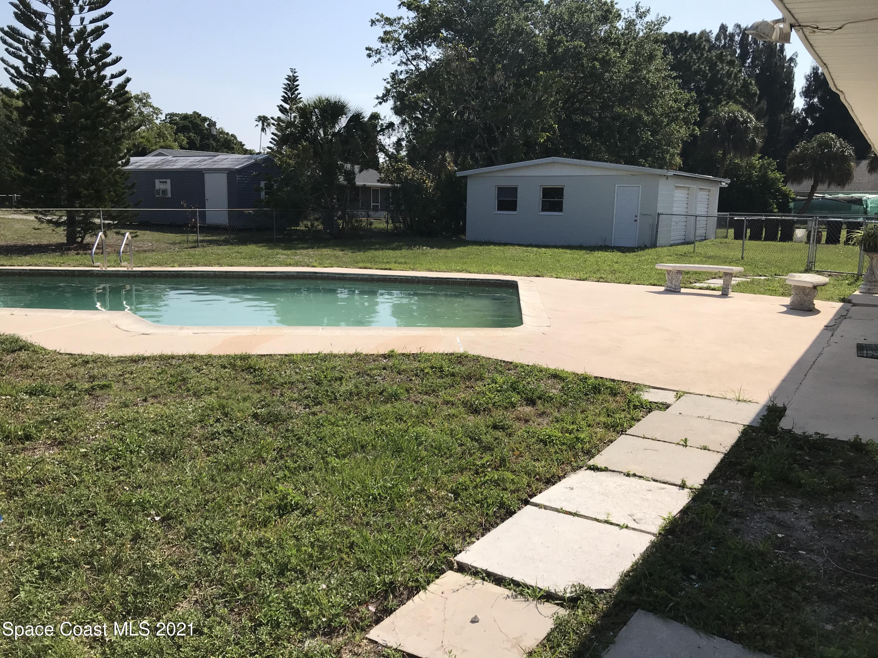 2545 2nd Avenue Northeast Palm Bay, FL 32905 - Photo 16 of 32 a view of a house with a yard