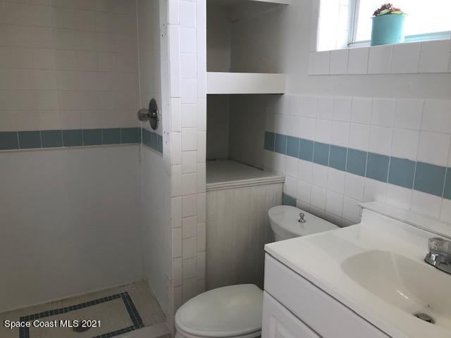 2545 2nd Avenue Northeast Palm Bay, FL 32905 - Photo 25 of 32 a bathroom with a toilet and a sink