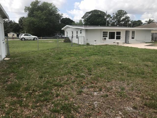 2545 2nd Avenue Northeast Palm Bay, FL 32905 - Photo 27 of 32 a view of a house with a yard