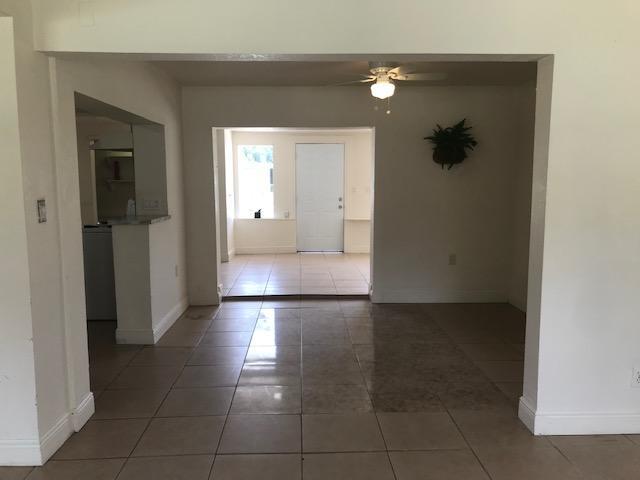 2545 2nd Avenue Northeast Palm Bay, FL 32905 - Photo 4 of 32 a view of a hallway with wooden floor