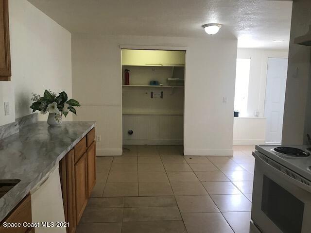 2545 2nd Avenue Northeast Palm Bay, FL 32905 - Photo 6 of 32 a kitchen with a sink and cabinets