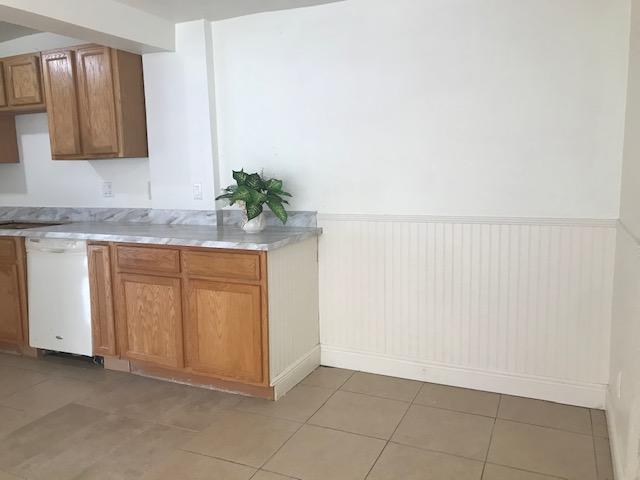 2545 2nd Avenue Northeast Palm Bay, FL 32905 - Photo 8 of 32 a view of a kitchen with white cabinets