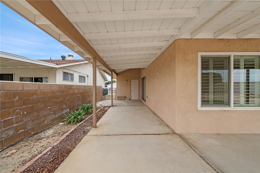 26932 Howard Street Menifee, CA 92586 - Photo 18 of 28 a view of a house with a backyard