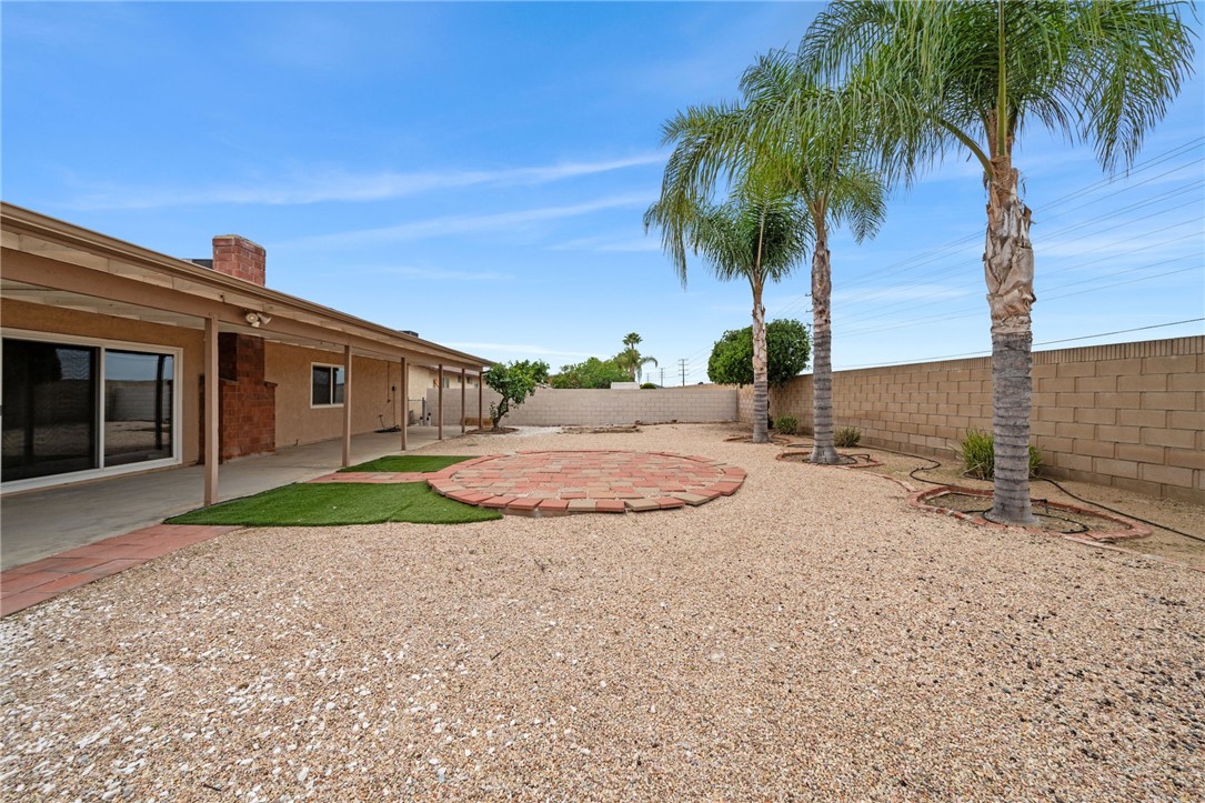 26932 Howard Street Menifee, CA 92586 - Photo 21 of 28 a front view of a house with a yard and garage