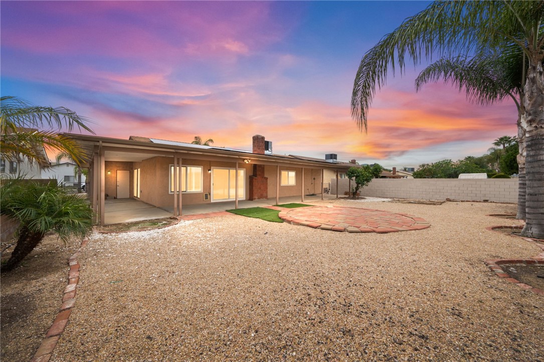 26932 Howard Street Menifee, CA 92586 - Photo 4 of 28 a view of a house with a yard and potted plants