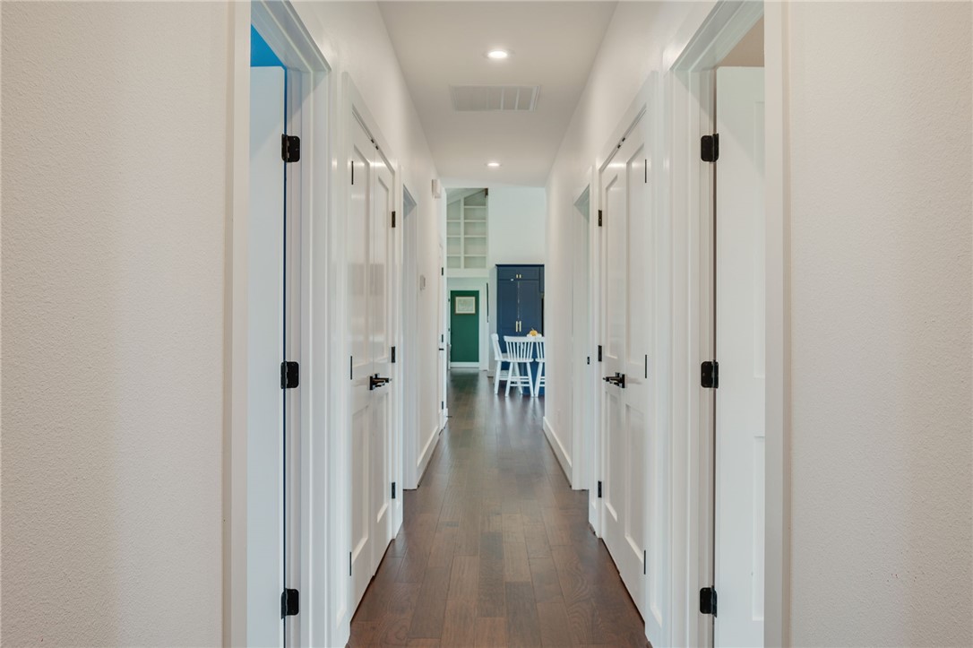 2970 County Road 270 Cameron, TX 76520 - Photo 25 of 50 a view of a hallway with a wooden door