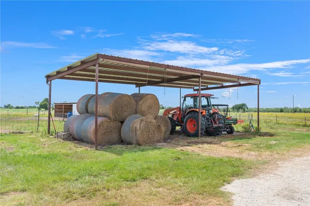 a view of a car is parked in front of a house