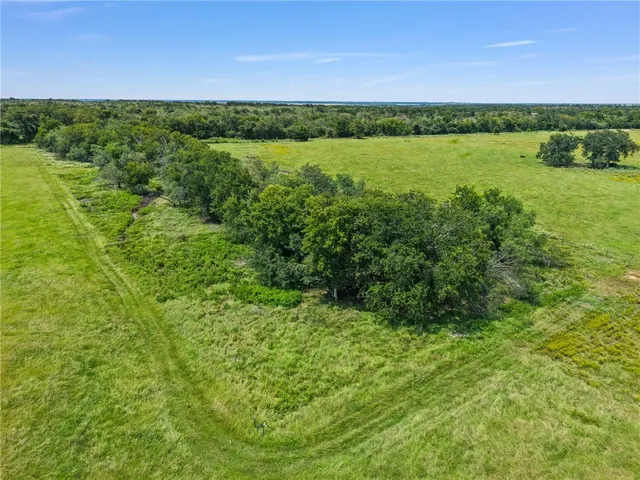 a view of an ocean house swimming pool and a yard