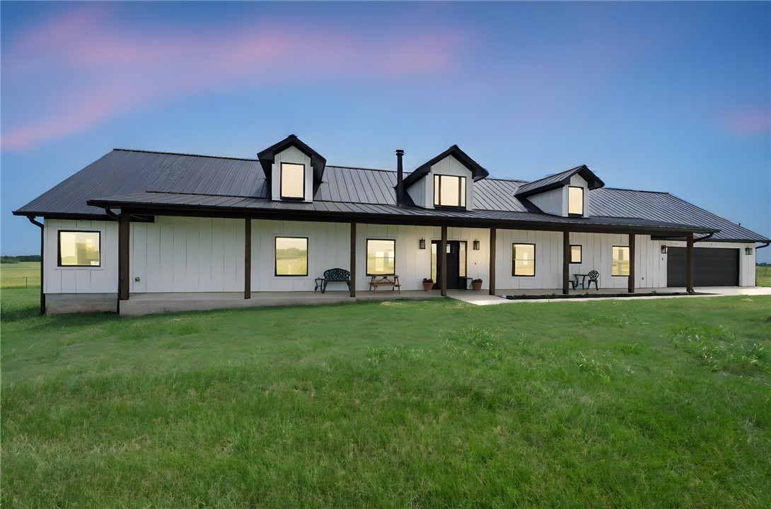 2970 County Road 270 Cameron, TX 76520 - Photo 6 of 50 a front view of a house with a garden