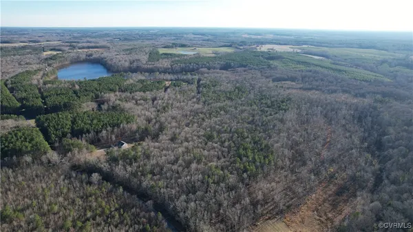 a view of a lake with beach and mountain view