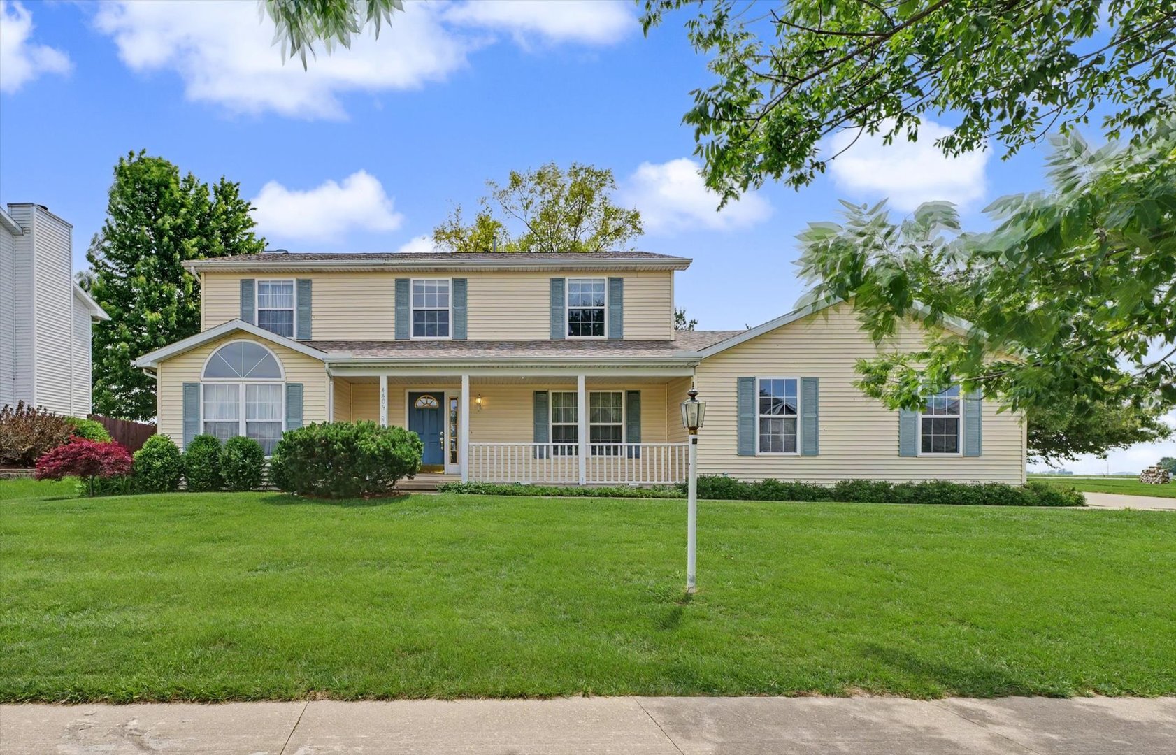 4409 Copper Ridge Road Champaign, IL 61822 - Photo 2 of 40 a front view of a house with a yard