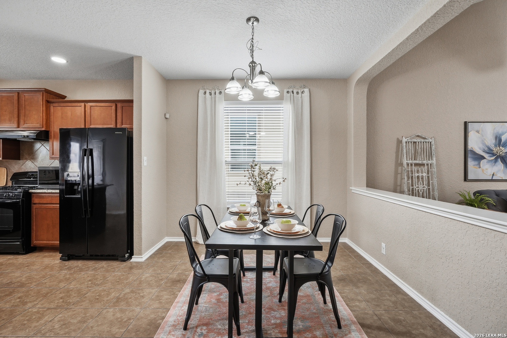9519 Gold Stage Road San Antonio, TX 78254 - Photo 11 of 25 a view of a dining room with furniture window and wooden floor
